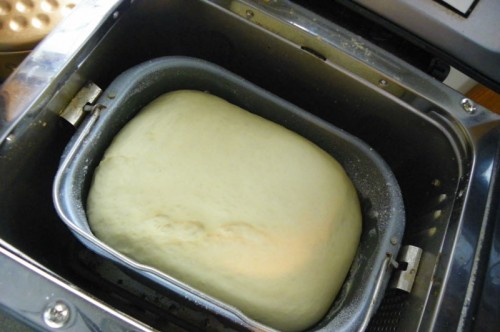 Letting the bread machine knead the dough